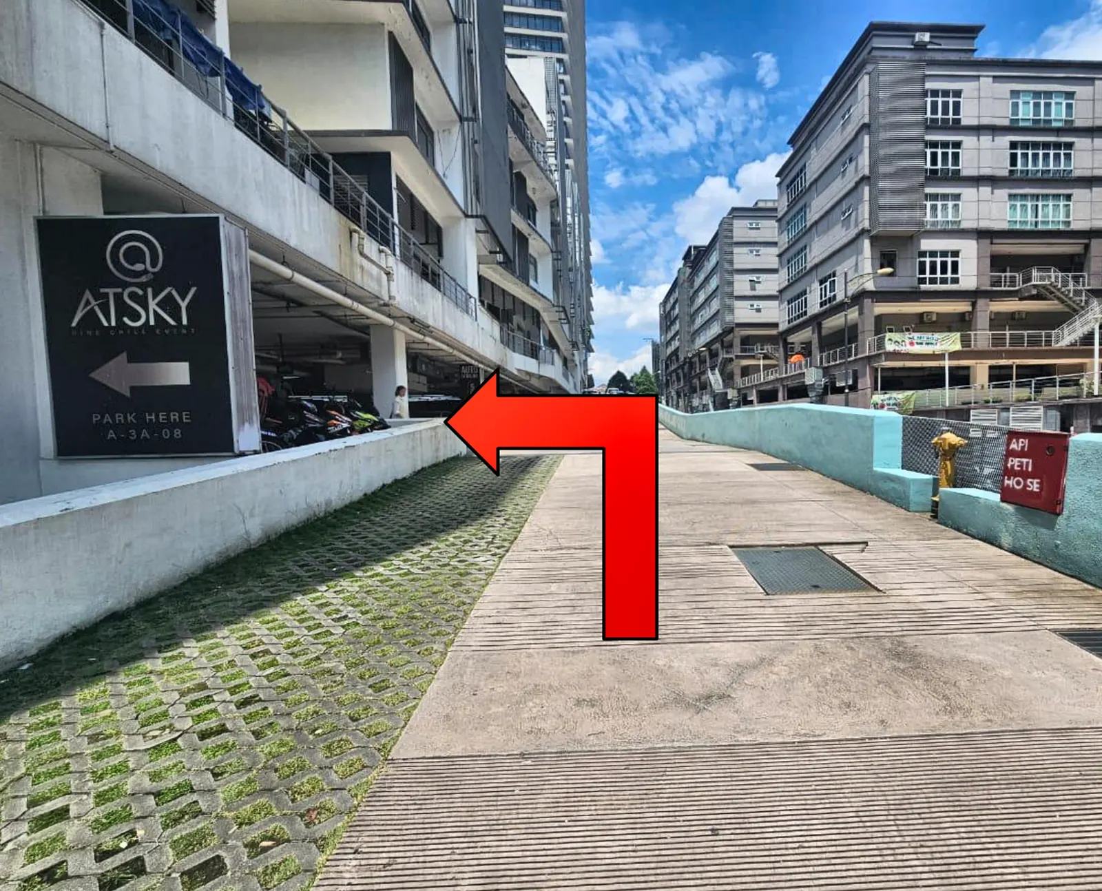 The ATSKY signboard: turn left here into the car park