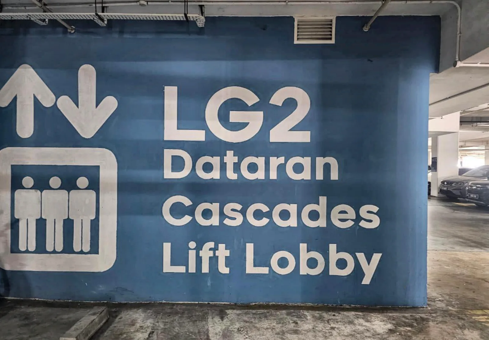 The blue LG2 Dataran Cascades Lift Lobby sign: take this lift to LG1